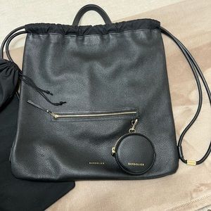 Bandolier sophisticated drawstring urban backpack.